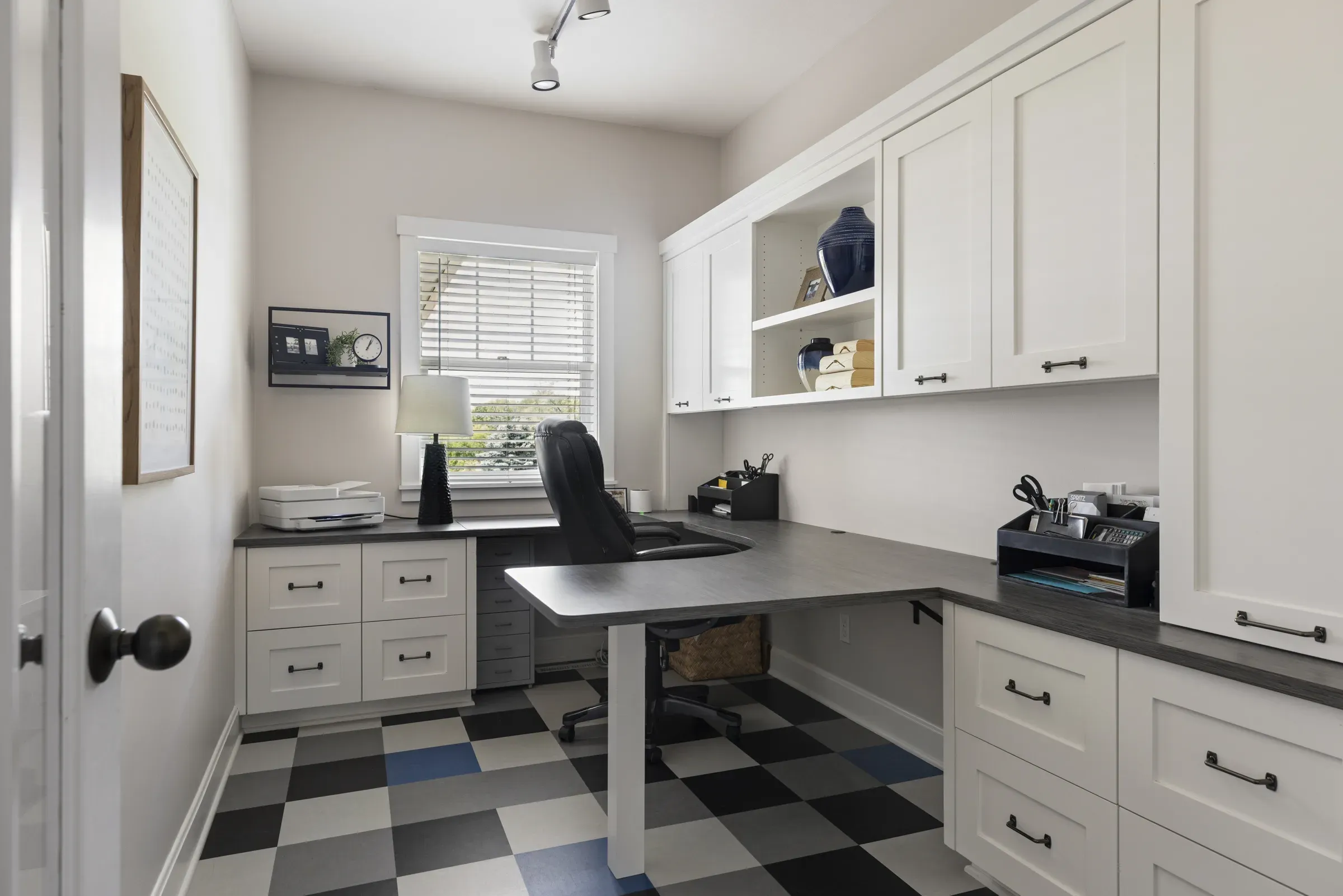 White melamine built-in cabinetry in a Lakeville home office remodel by Honey-Doers Remodeling